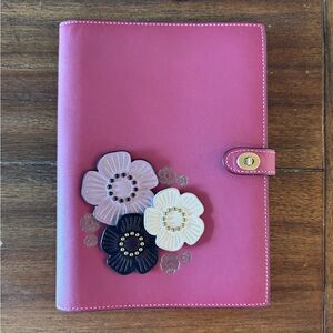 Coach Notebook, with coach create flowers and embossing.